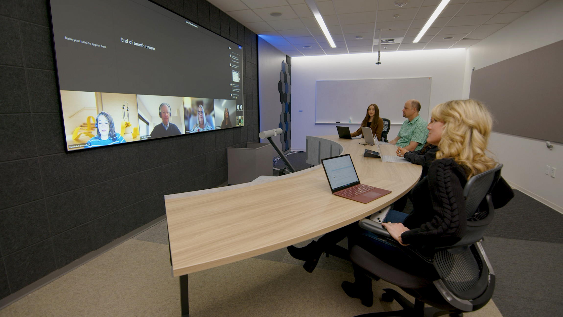 A cloud engineer collaborating with a team through video conferencing.